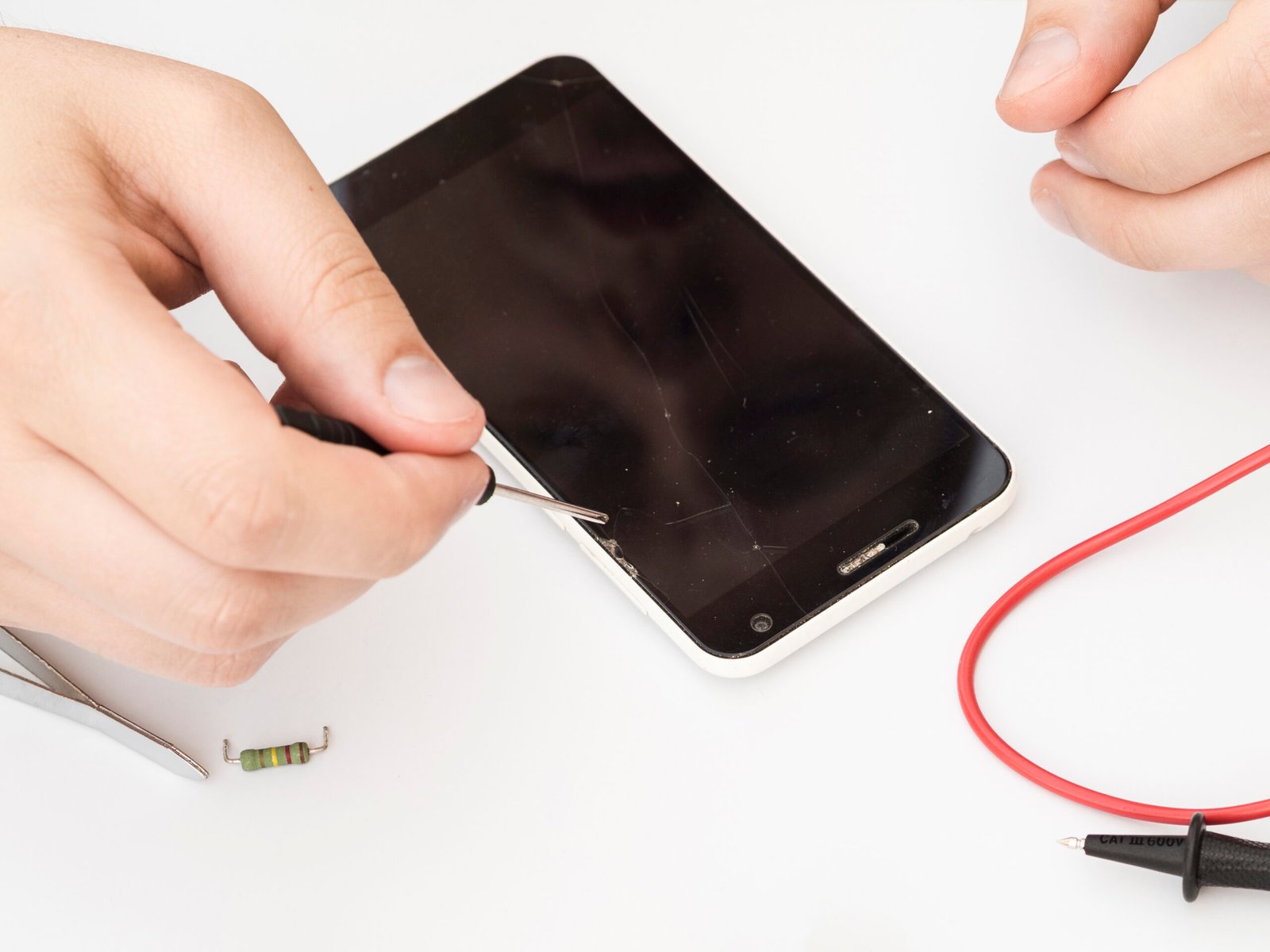 Smartphone charging port repair in progress