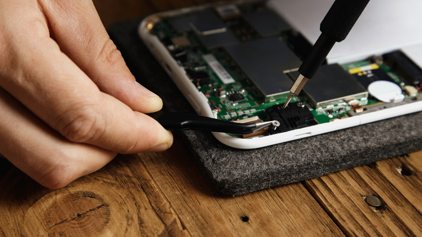 Smartphone camera repair in progress at a professional service center
