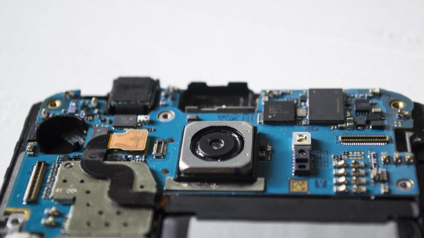 Camera repair technician fixing lens