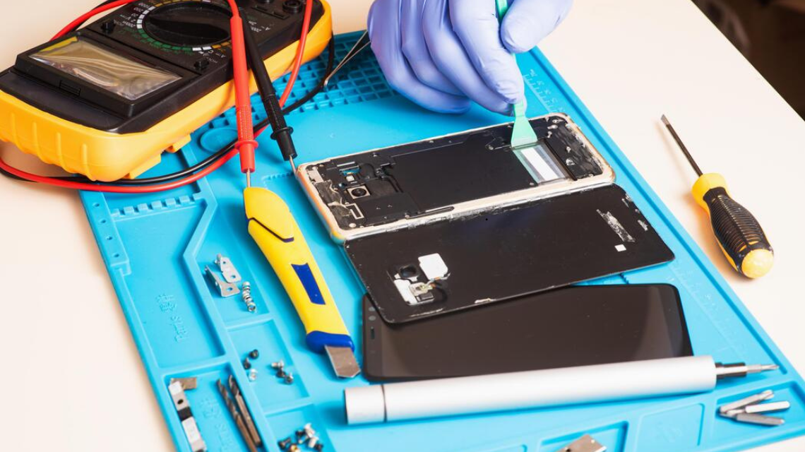 Professional phone repair service fixing damaged smartphone